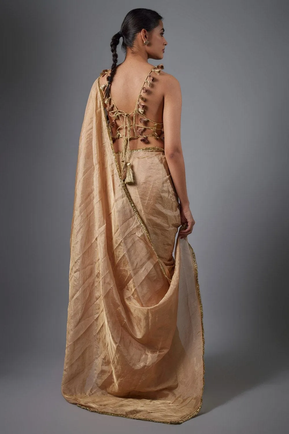 Dull Rose Color Embroidered Tissue Fabric Short Choli With Stitched Saree.