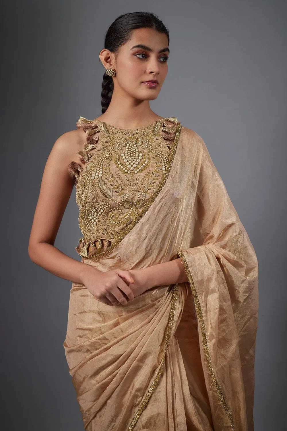 Dull Rose Color Embroidered Tissue Fabric Short Choli With Stitched Saree.