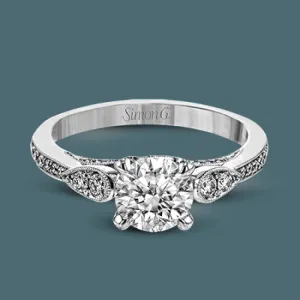 This absolutely charming white gold ring features a subtle, nature-inspired design as well as .32 ctw of round white diamonds.