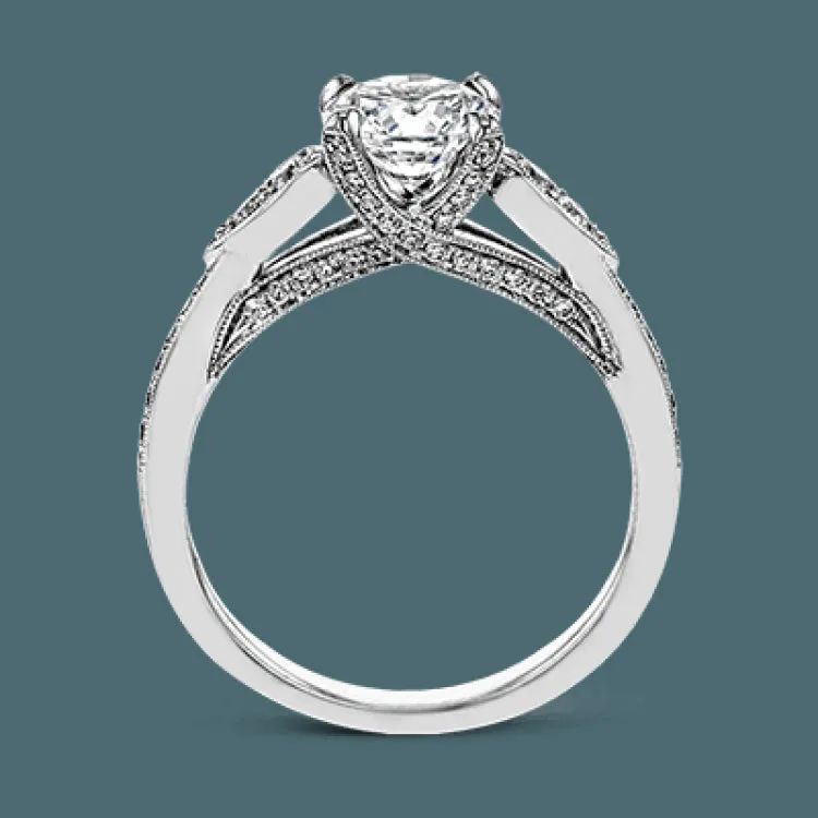 This absolutely charming white gold ring features a subtle, nature-inspired design as well as .32 ctw of round white diamonds.